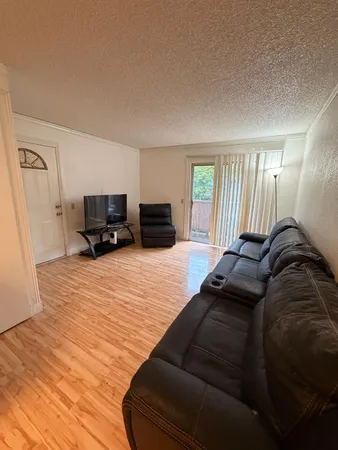 a bed room with a bed and a television
