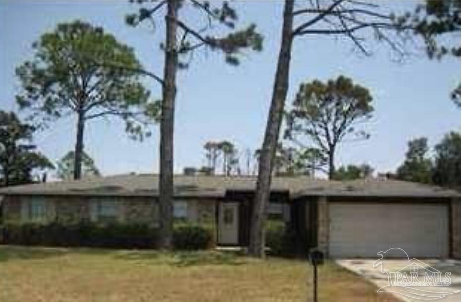 2775 Venetian Way Gulf Breeze, FL 32563 - Photo 1 of 6 a front view of a house with trees