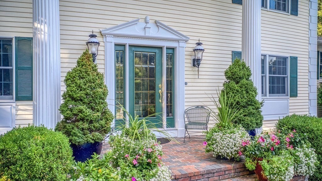 6 Braeburn Road Chelmsford, MA 01824 - Photo 3 of 42 a front view of a house with a garden