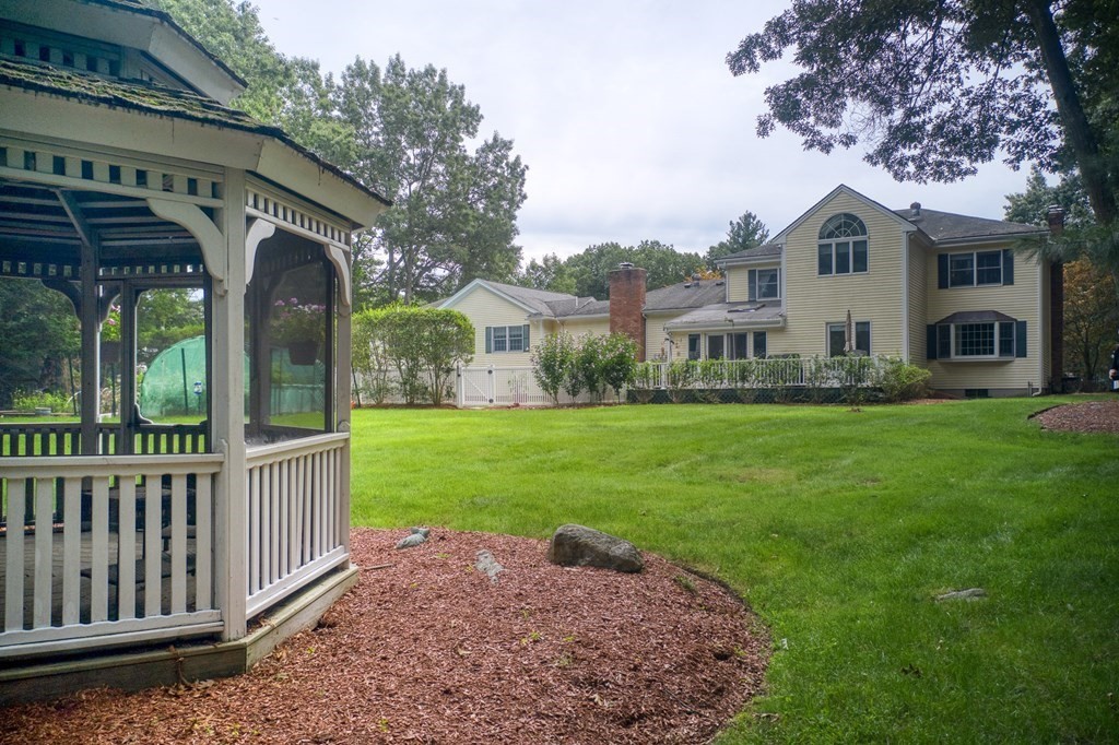 6 Braeburn Road Chelmsford, MA 01824 - Photo 34 of 42 a front view of house with yard and green space