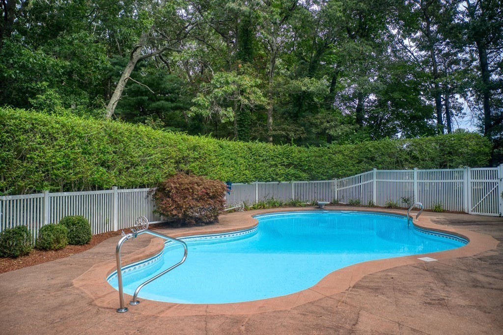 6 Braeburn Road Chelmsford, MA 01824 - Photo 36 of 42 a view of a backyard with swimming pool