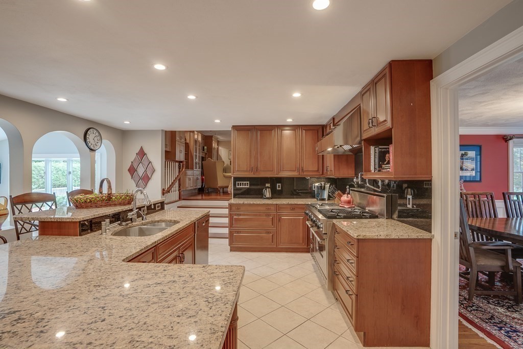 6 Braeburn Road Chelmsford, MA 01824 - Photo 4 of 42 a large kitchen with stainless steel appliances lots of counter space