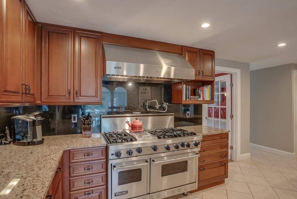 6 Braeburn Road Chelmsford, MA 01824 - Photo 8 of 42 a kitchen with granite countertop a stove and a sink