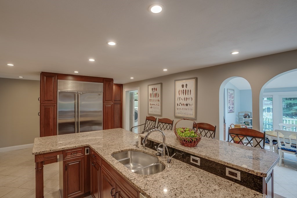 6 Braeburn Road Chelmsford, MA 01824 - Photo 9 of 42 a kitchen with counter top space a sink and stainless steel appliances