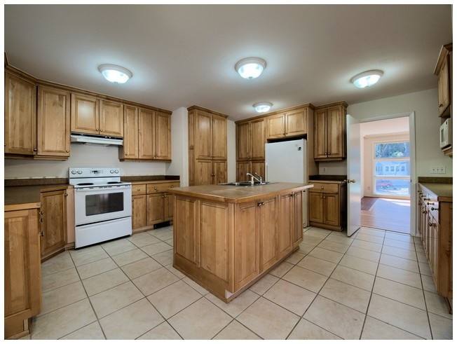 3309 Leonard Street Raleigh, NC 27607 - Photo 2 of 21 Beautiful Cabinetry, Pull Out Drawers in Cabinets, Center Island, Tile Floors, Counter Space Galore. Spacious Kitchen