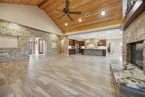 a view of a hall with wooden floor