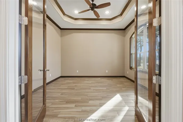 a view of a hallway with a glass door