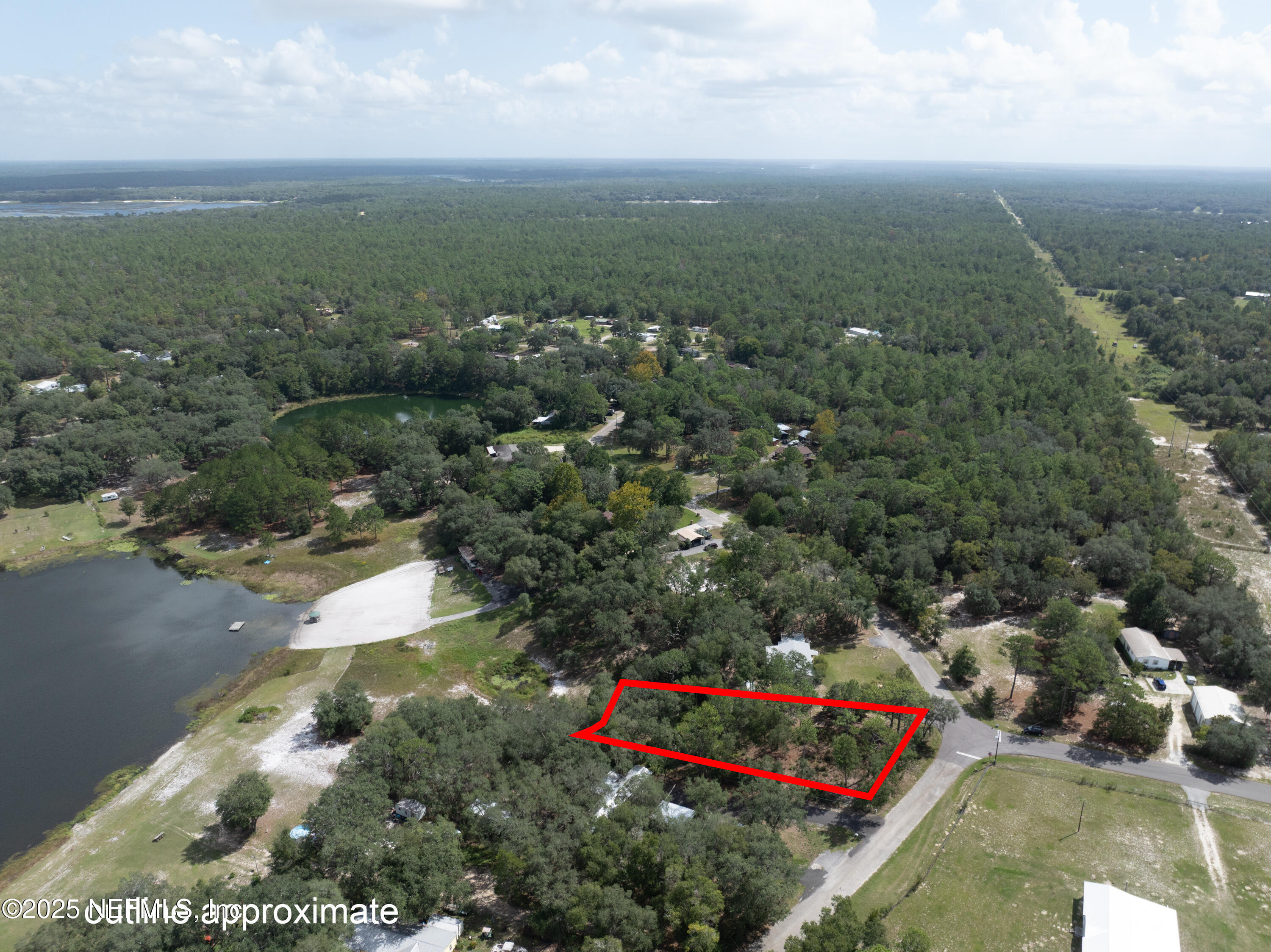 6956 Deer Springs Road Keystone Heights, FL 32656 - Photo 8 of 10 a view of a bunch of trees and houses in back yard