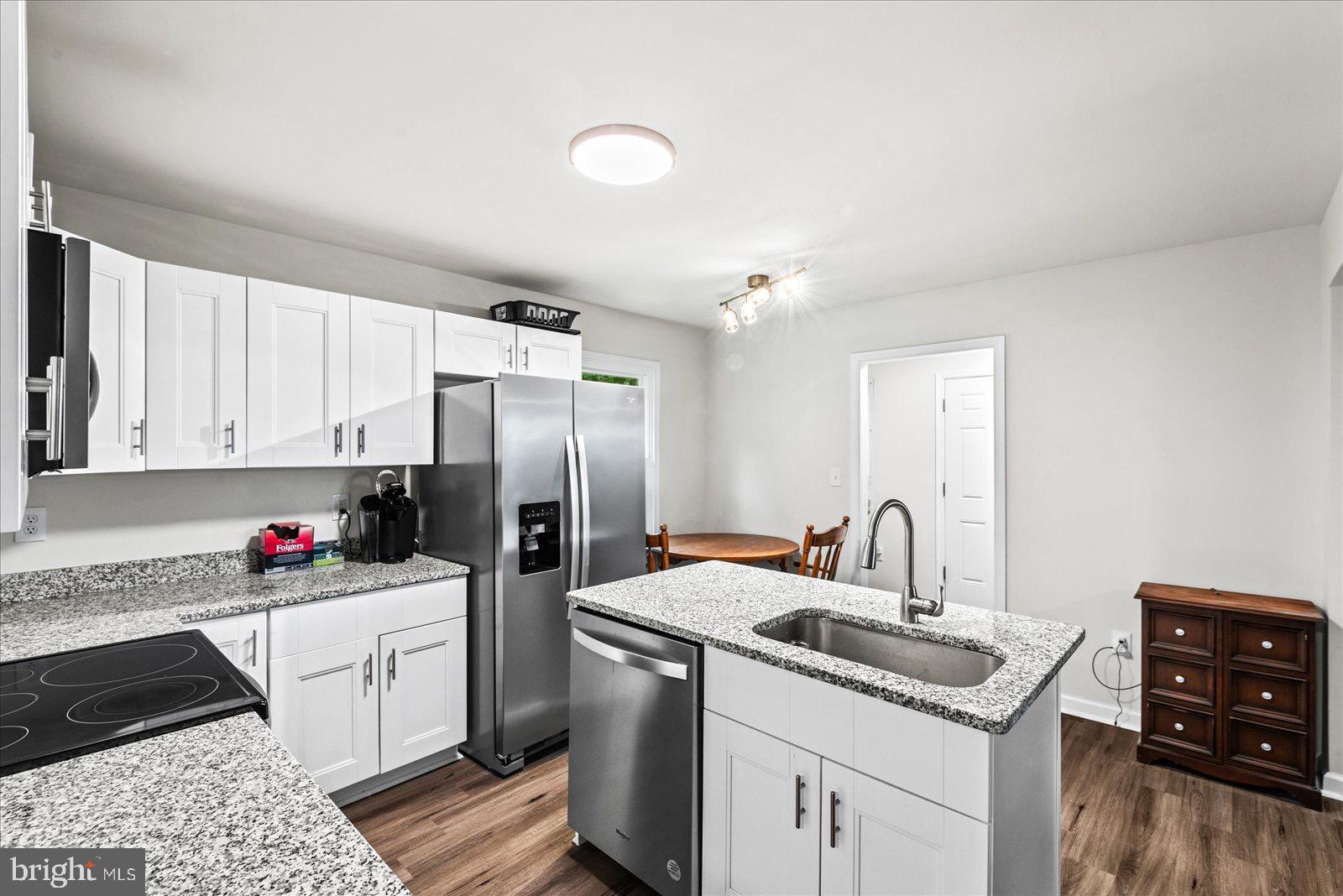 2010 Lake Road Lottsburg, VA 22511 - Photo 6 of 18 a kitchen with a sink cabinets and stainless steel appliances