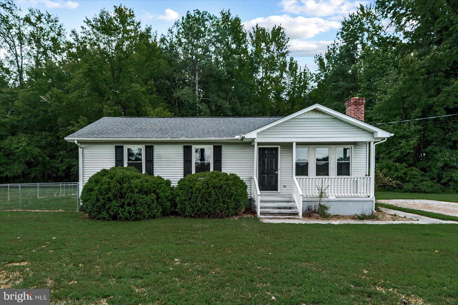 2010 Lake Road Lottsburg, VA 22511 - Photo 7 of 18 a front view of a house with a yard