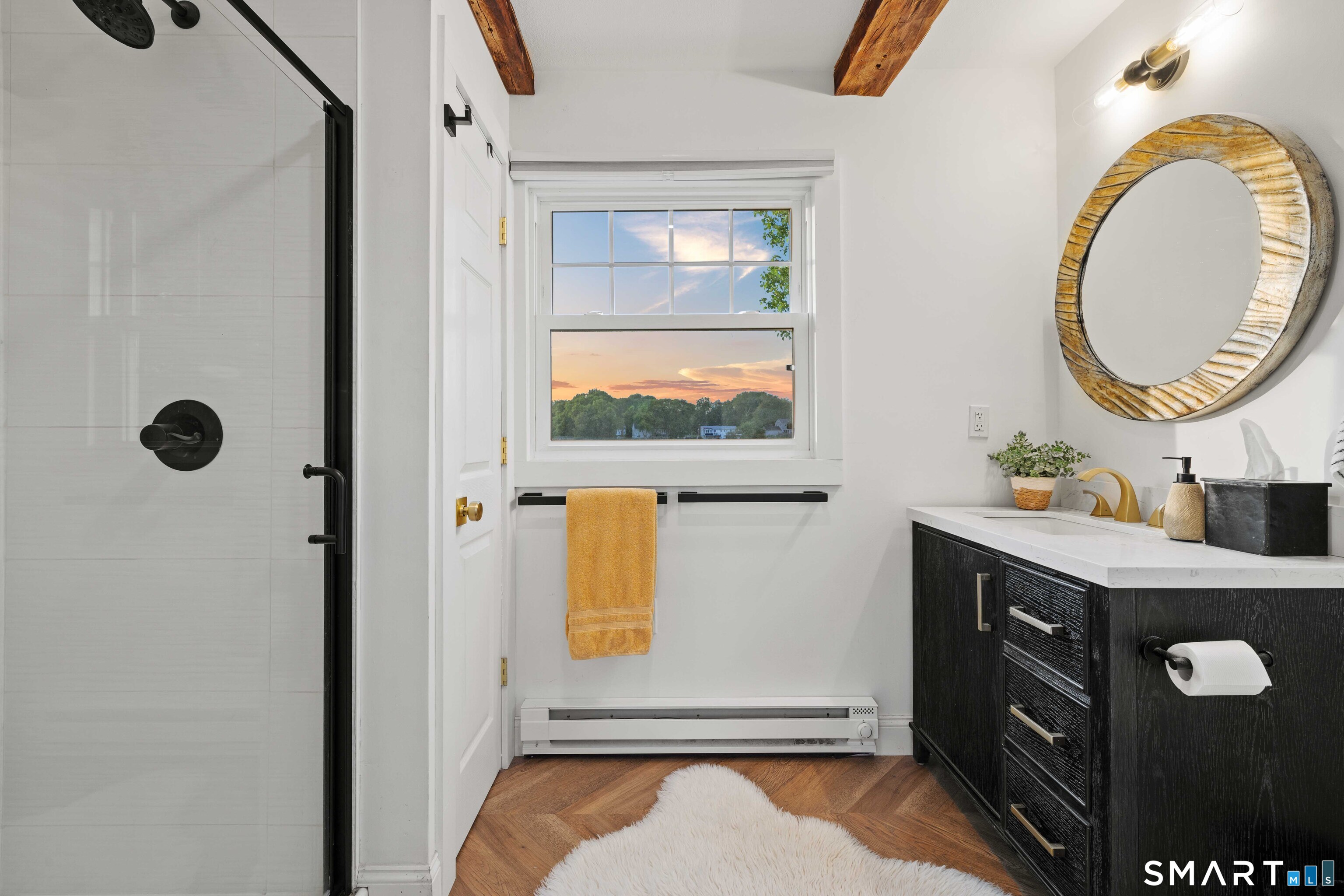 129 Nehantic Trail Old Saybrook, CT 06475 - Photo 11 of 28 a bathroom with a sink a mirror and a shower