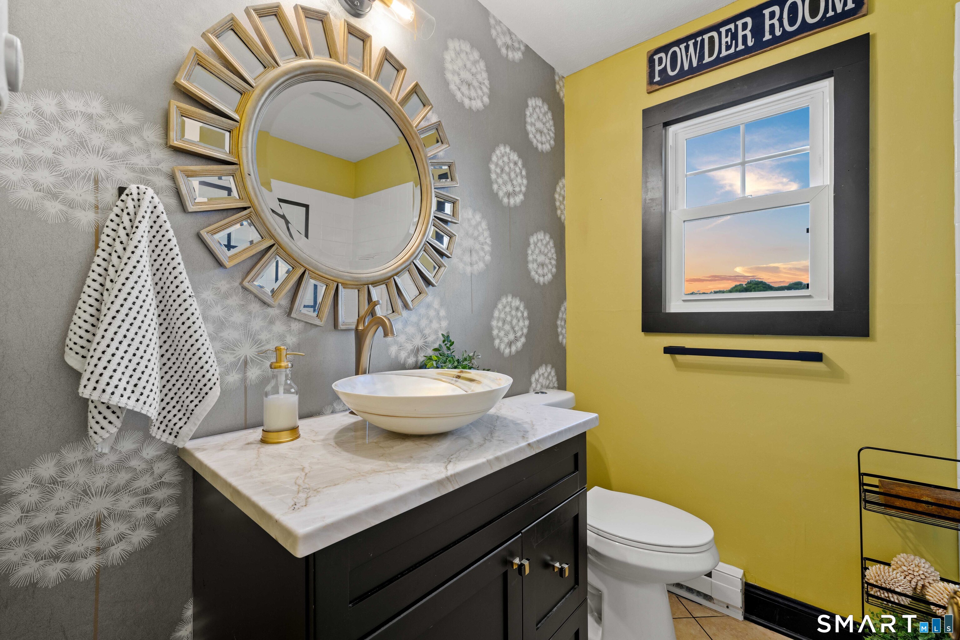129 Nehantic Trail Old Saybrook, CT 06475 - Photo 14 of 28 a bathroom with a toilet a sink and a mirror
