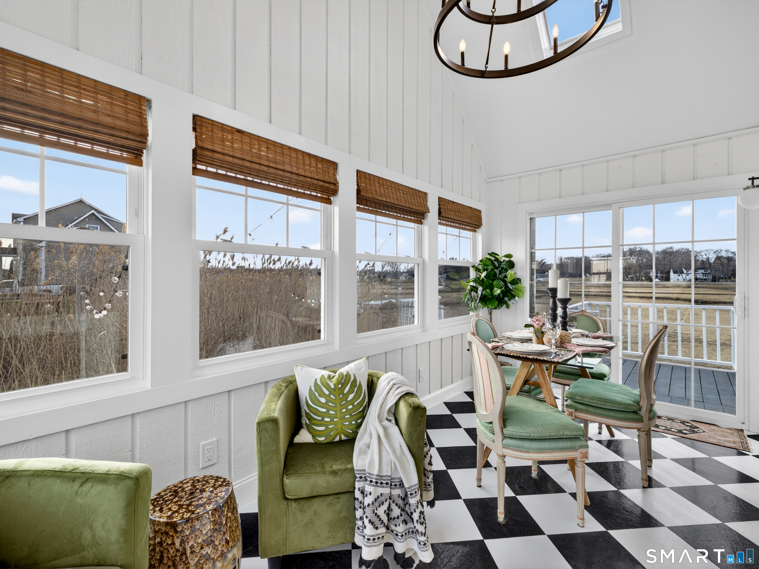 129 Nehantic Trail Old Saybrook, CT 06475 - Photo 7 of 28 a living room with furniture and a large window