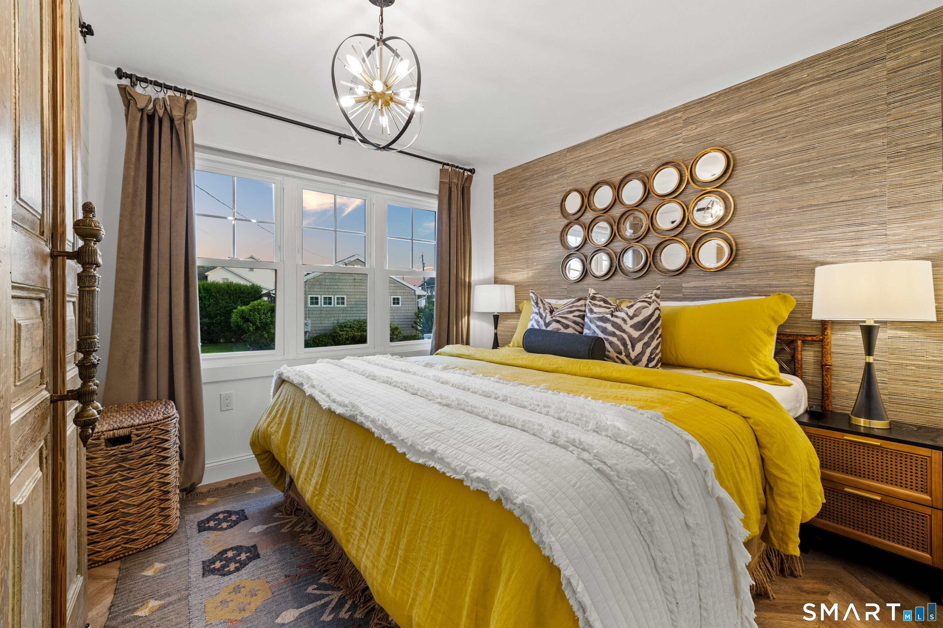 129 Nehantic Trail Old Saybrook, CT 06475 - Photo 10 of 28 a spacious bedroom with a bed and window