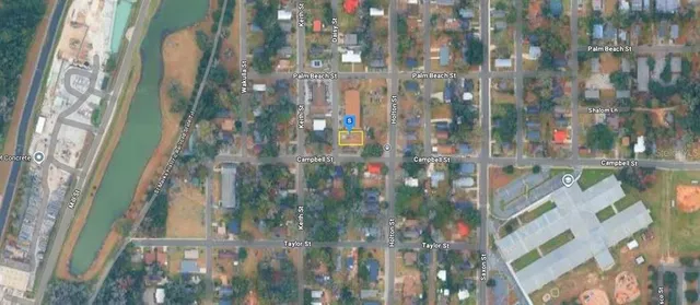 a view of a house with a tree park