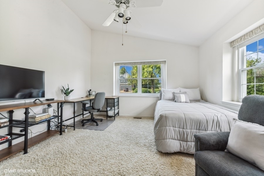 393 Bentley Place Buffalo Grove, IL 60089 - Photo 12 of 16 a bedroom with furniture and a flat screen tv