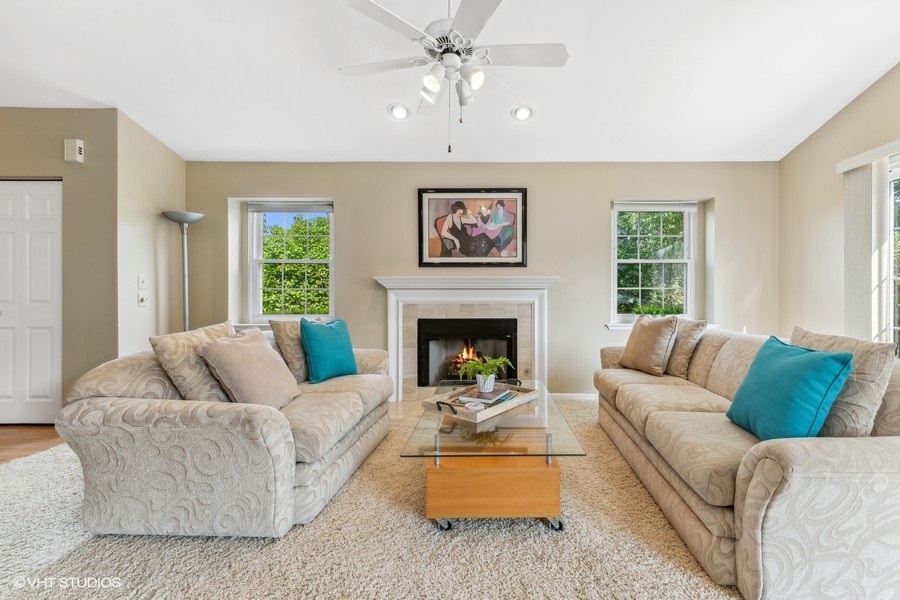 393 Bentley Place Buffalo Grove, IL 60089 - Photo 4 of 16 a living room with furniture and a fireplace