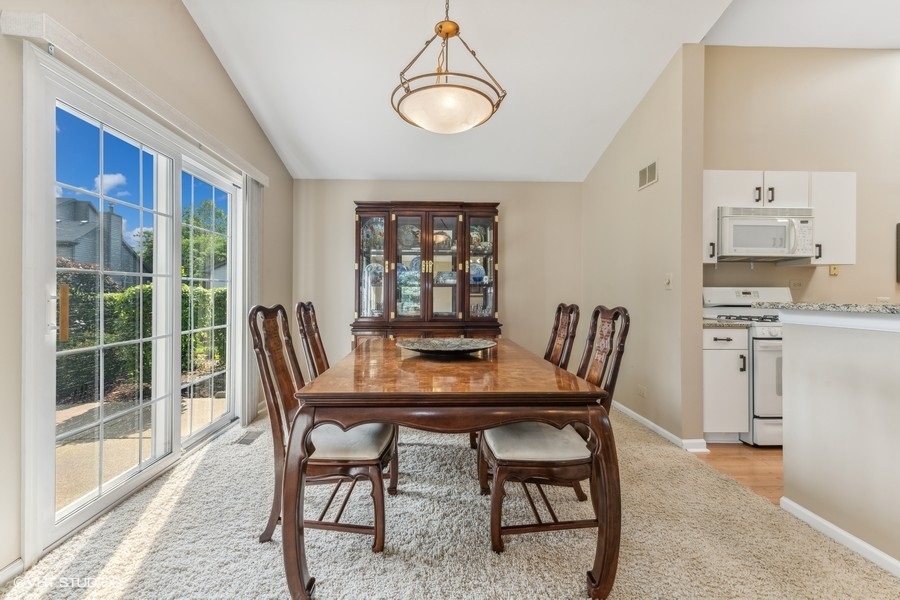 393 Bentley Place Buffalo Grove, IL 60089 - Photo 6 of 16 a dining room with furniture and window