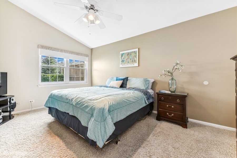 393 Bentley Place Buffalo Grove, IL 60089 - Photo 9 of 16 a bedroom with a bed and window