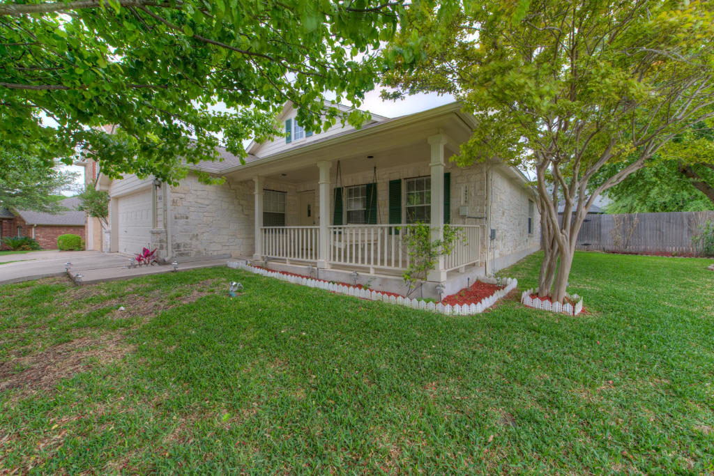 14816 Jacks Pond Road Austin, TX 78728 - Photo 1 of 1 a view of a house with a yard and a large tree