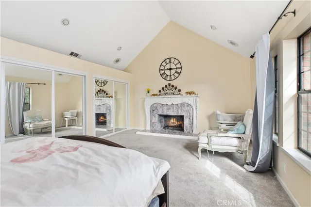 a bedroom with a bed and a chair