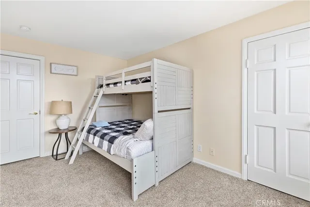 a front view of a house with swimming pool having outdoor seating