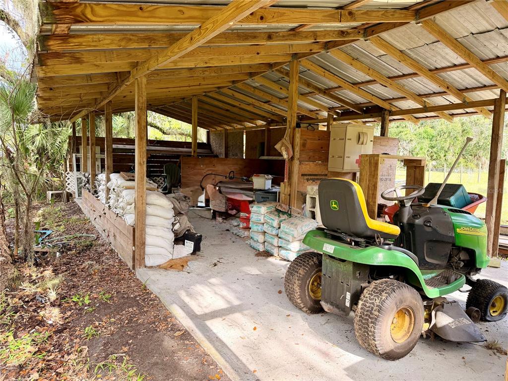 685 Eagle Watch Road Oak Hill, FL 32759 - Photo 16 of 21 a view of a garage with furniture