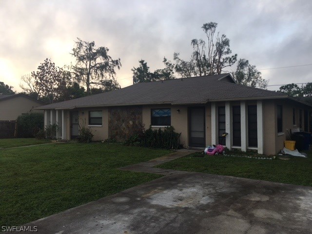 7460 Garry Road Fort Myers, FL 33967 - Photo 3 of 21 a front view of a house with a garden