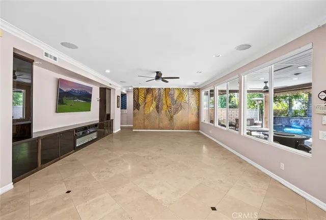 a view of an empty room with windows