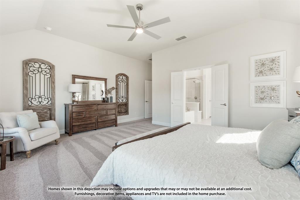 12709 Cactus Court Godley, TX 76044 - Photo 25 of 40 a spacious bedroom with a bed a couch and dresser