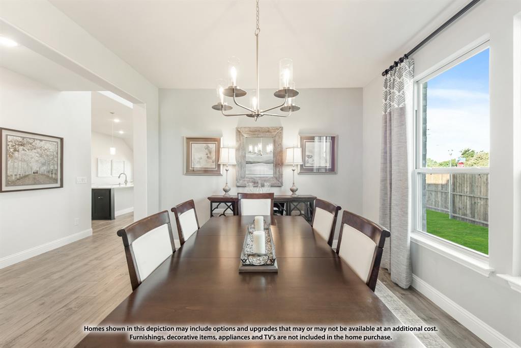 12709 Cactus Court Godley, TX 76044 - Photo 6 of 40 a view of a dining room with furniture window and wooden floor