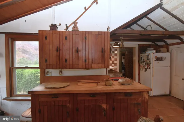 a kitchen with stainless steel appliances granite countertop a stove and a refrigerator