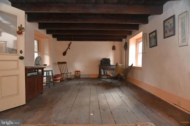 a view of livingroom with furniture and hardwood floor