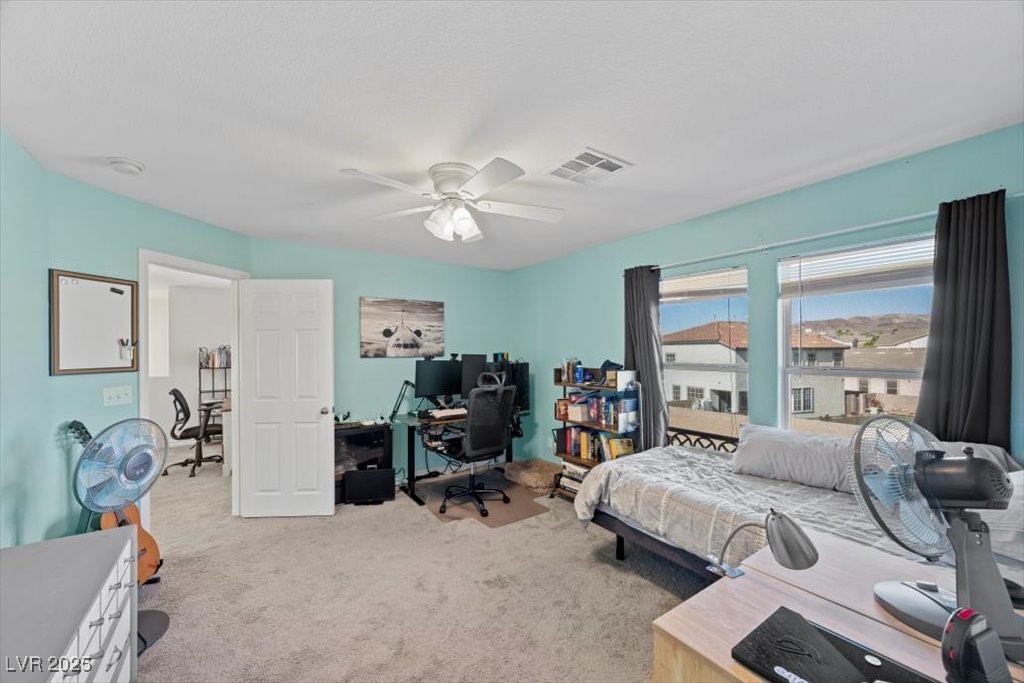 249 Cinnamon Ridge Way Henderson, NV 89015 - Photo 43 of 76 Bedroom featuring an office area, carpet, and ceiling fan