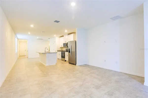 a view of a kitchen with a sink