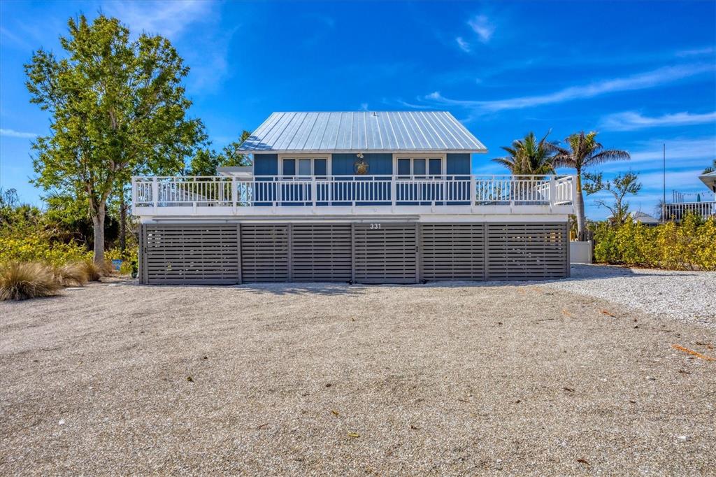 331 Bocilla Drive Boca Grande, FL 33921 - Photo 1 of 34 a view of a house with a outdoor space