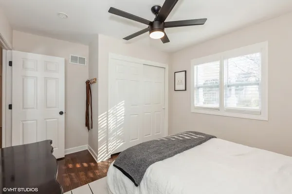 a bedroom with a bed and a window