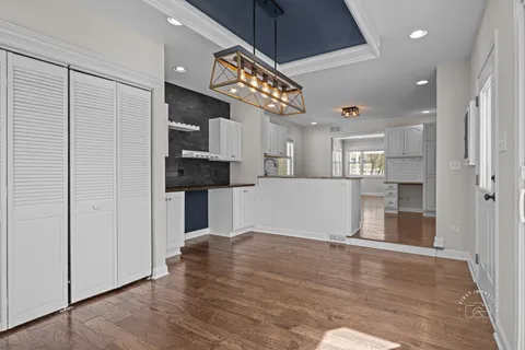a view of an entryway with wooden floor