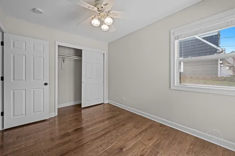 a bathroom with a toilet sink vanity tub and shower