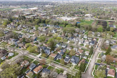 an aerial view of residential houses with outdoor space