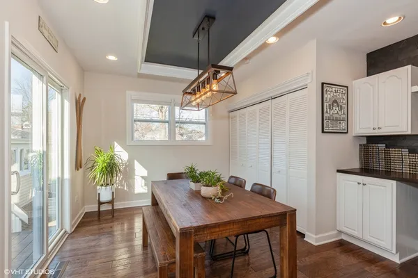 a view of a dining room with furniture window and wooden floor
