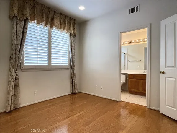 an empty room with an entrance to other room