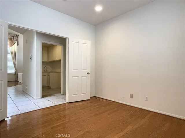 a view of empty room with fireplace and window