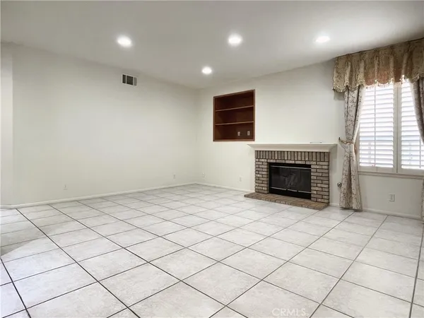 a kitchen with stainless steel appliances granite countertop a stove a sink a microwave and a refrigerator