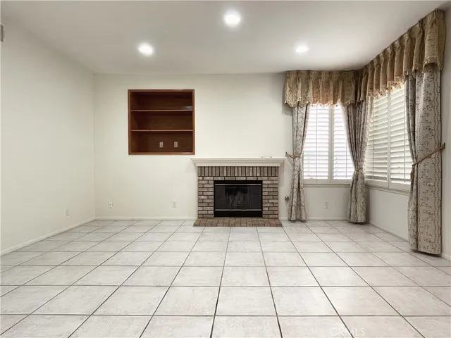 a kitchen with stainless steel appliances granite countertop a sink a stove and a wooden cabinets