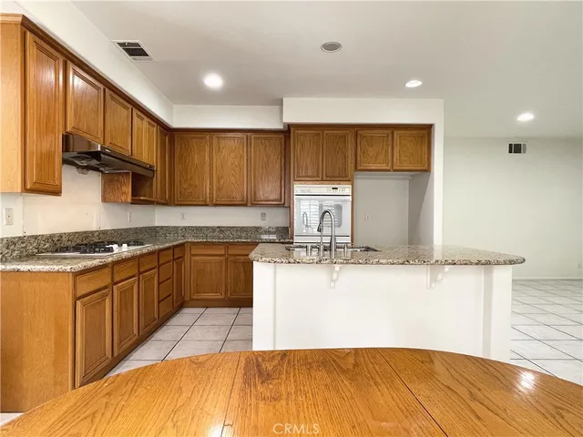 a view of staircase with railing and wooden floor