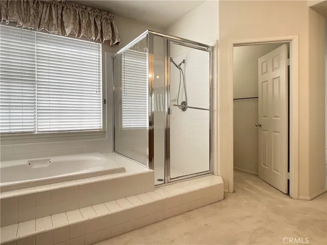 a bathroom with a sink double vanity and a mirror