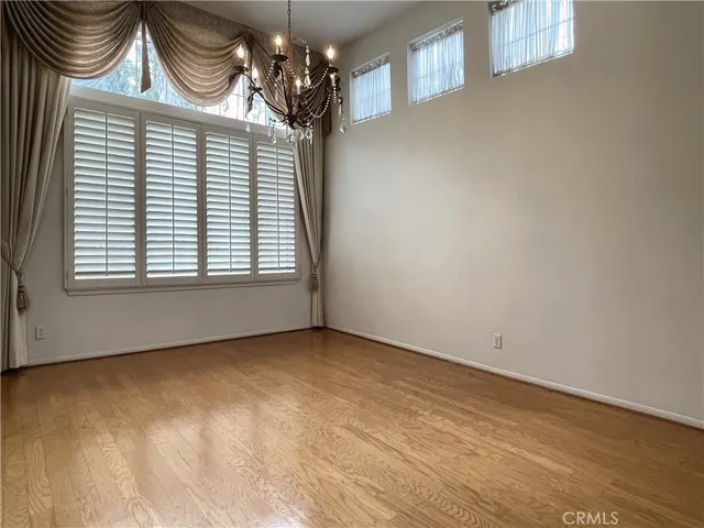 a view of staircase with white walls and a window