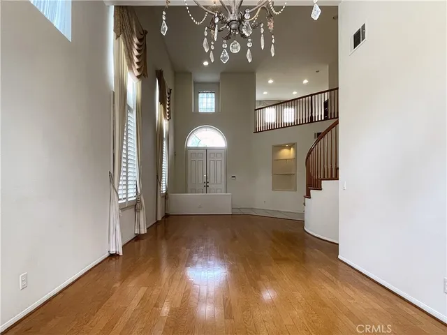 a view of a hallway with bathroom and a view of bedroom