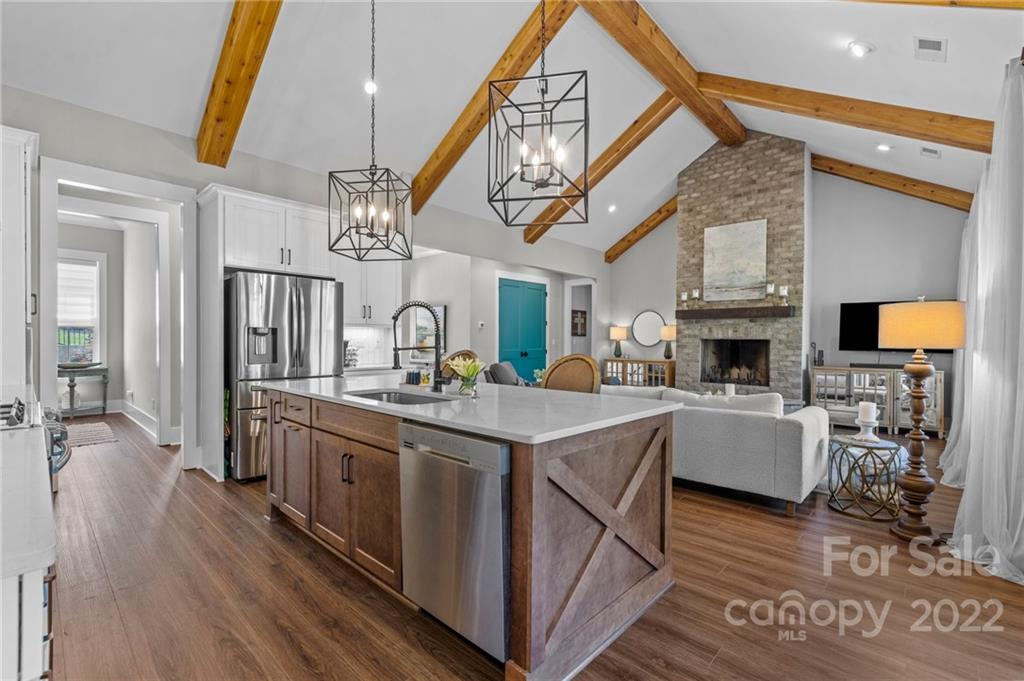 11099 Pheasant Run Tega Cay, SC 29708 - Photo 11 of 47 a kitchen with stainless steel appliances granite countertop a stove and cabinets